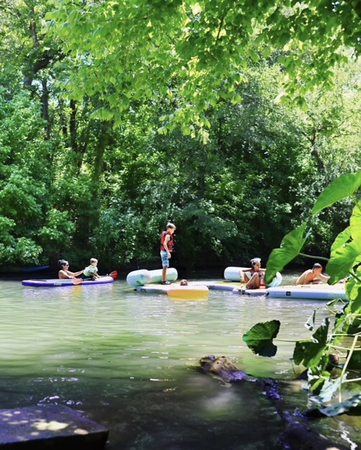 Friends relaxing on tubes in the river