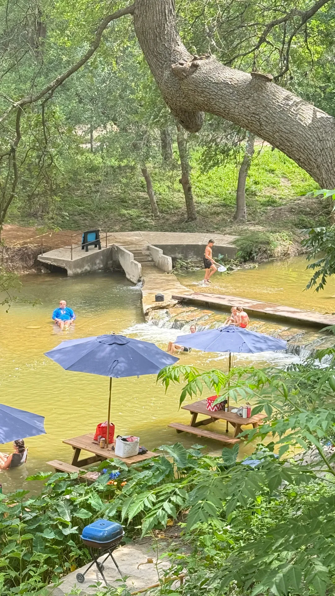In-water picnic tables with dam and swimming area