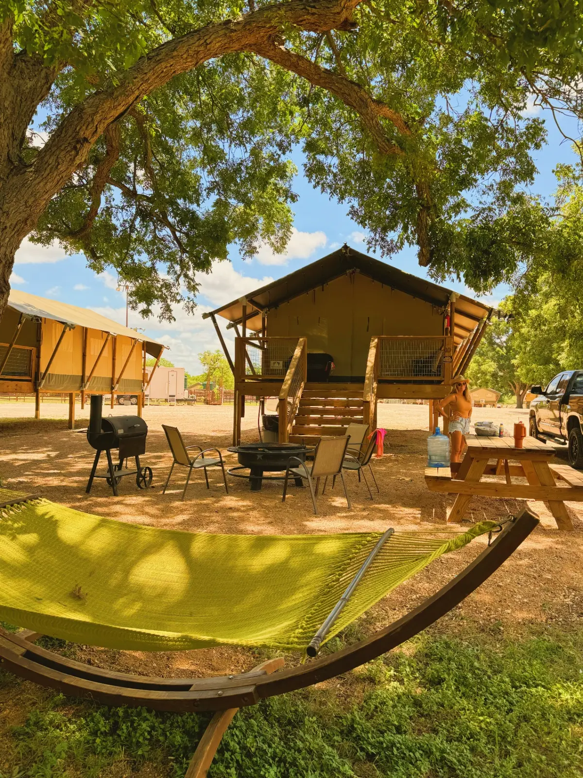 Safari cabin glamping exterior with hammock near San Antonio