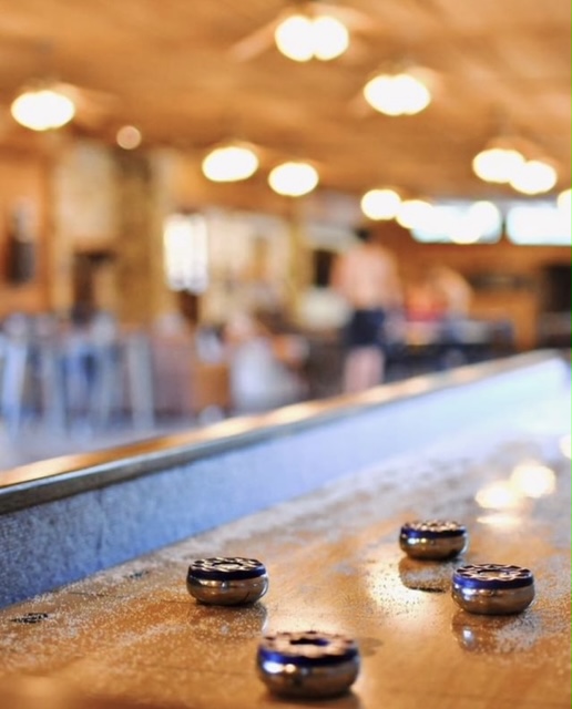 Guests relaxing by the river with chairs
