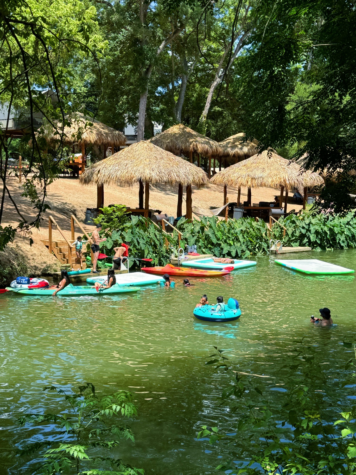 Creek activity with paddleboards and cabanas