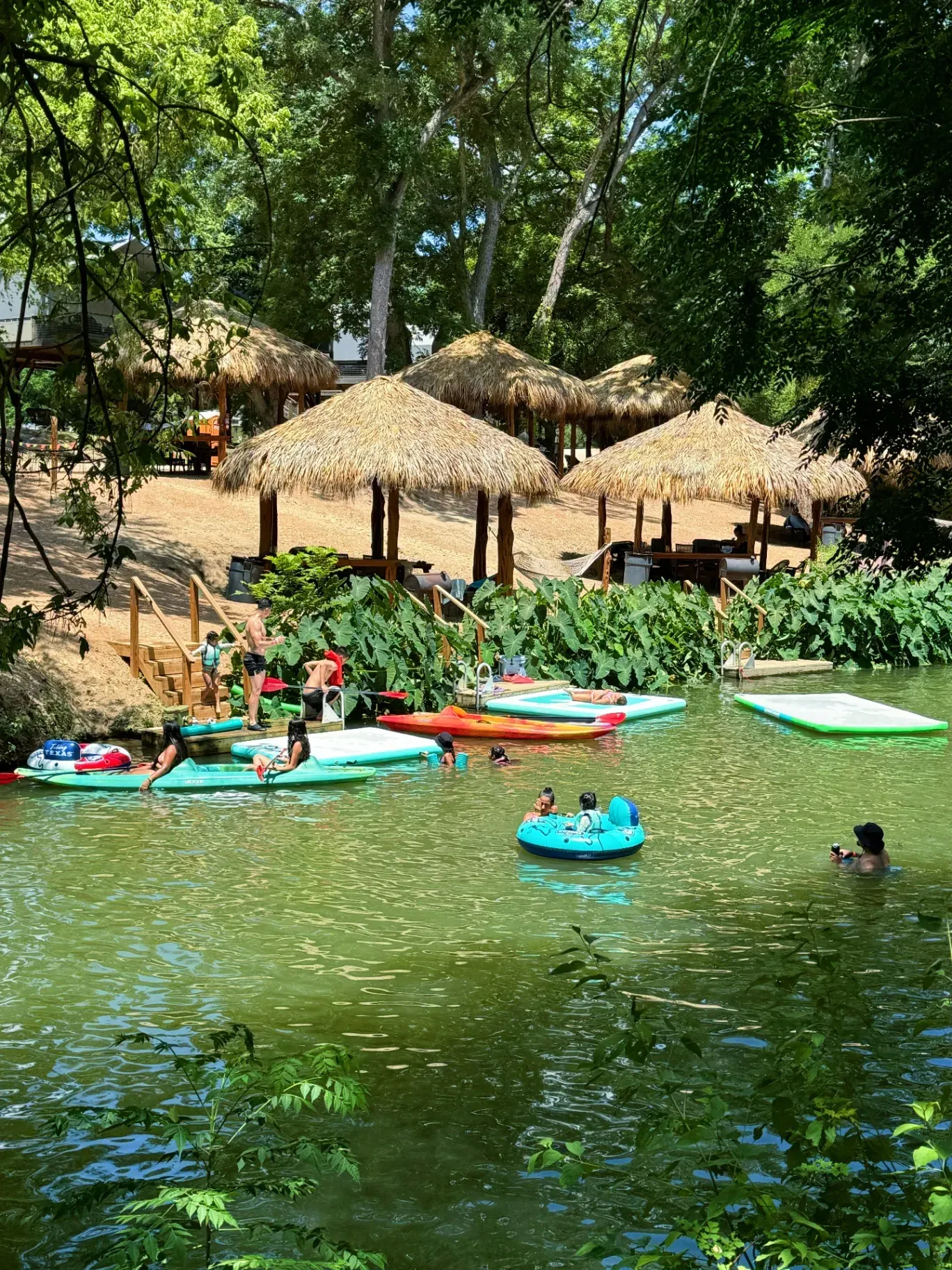 Creek activity with paddleboards and cabanas