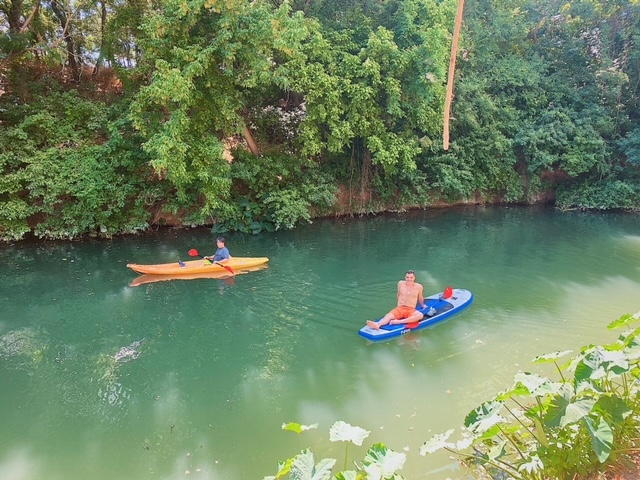 Relaxing on paddleboard in creek