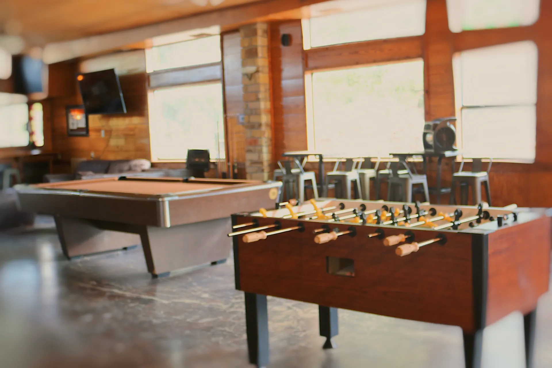 Foosball and pool tables in gameroom